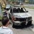 El carro, tipo camioneta, rojo, Isuzu Rodeo, agarró fuego, mientras que los ocupantes desaparecieron de la escena.